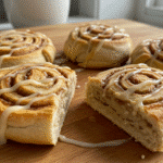 Tortilla Cinnamon Rolls topped with glaze on wooden table