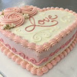 vintage cake heart cake with pink frosting and message