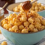 Golden honey popcorn recipe in wooden bowl showing glossy caramelized coating and crispy texture